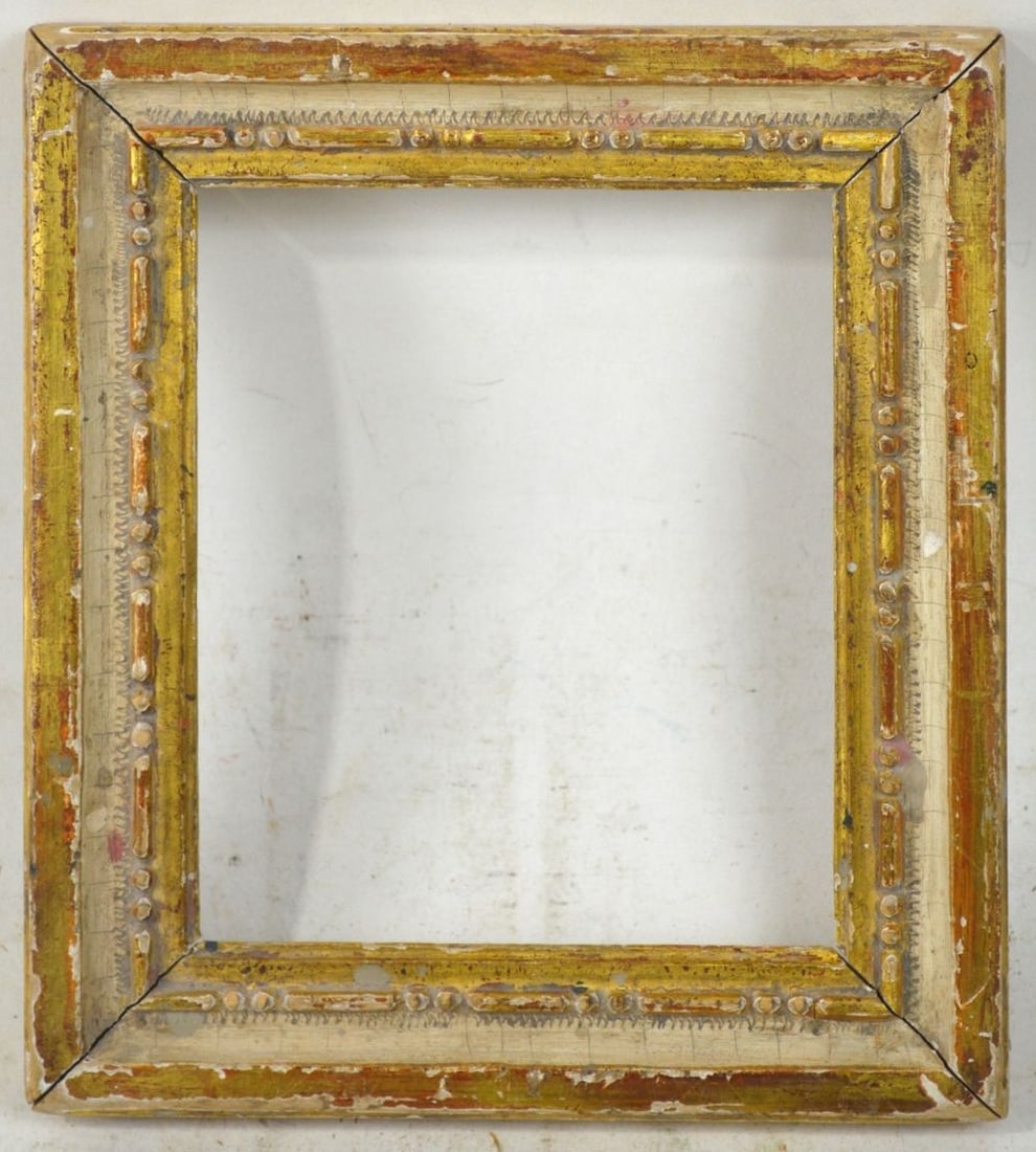CARVED GILT FRENCH FRAME: A very good miniature French provincial frame. Giltwood outer edge with a cream colored scoop with incised detail with a beaded / ridge inner gilt edge. Measures: 8" x 7" Rabbet: 6" x 5"