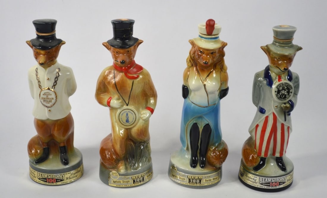 4 JIM BEAM REGAL CHINA CHARACTER BOTTLES: A group of 4 Jim Beam Regal china porcelain figures. Dated as follows: 2 X 1974 1 X 1963 1 X 1971 Measures: 12 3/4" x 4" x 4"