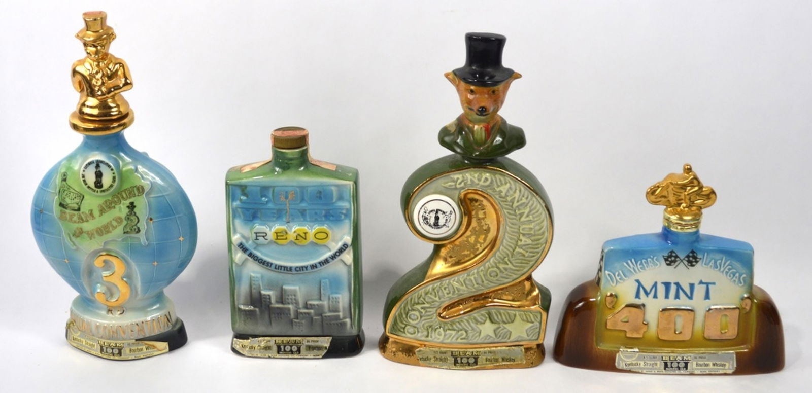 4 JIM BEAM REGAL CHINA CHARACTER BOTTLES: A group of 4 Jim Beam Regal china porcelain collector bottles. Dated as follows: 1 x 1973 1 x 1972 1 x 1968 1 x 1971 Measures: 14" x 6 1/2" x 2 1/2"