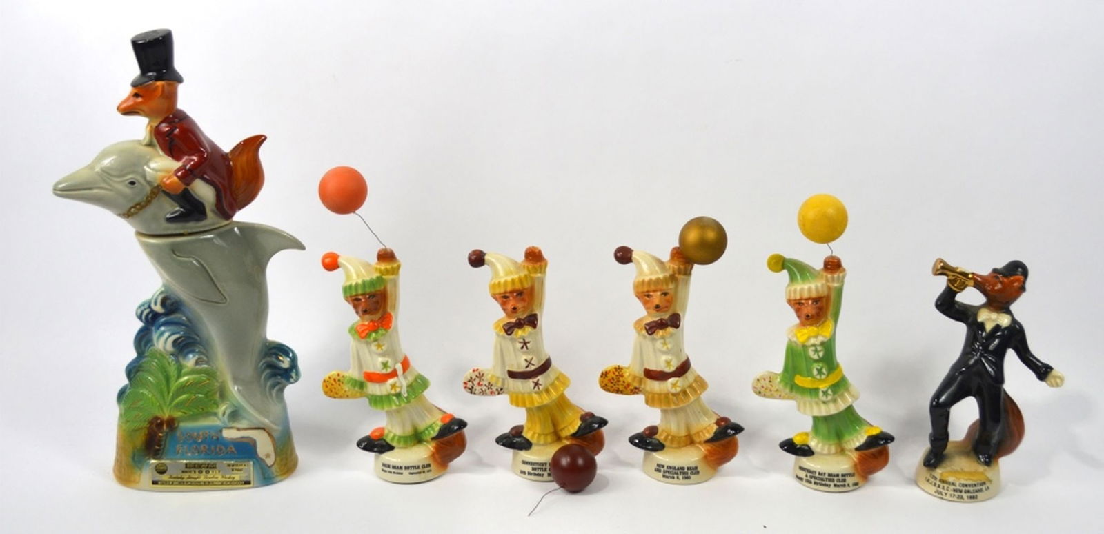 6 JIM BEAM REGAL CHINA CHARACTER BOTTLES: A group of 6 Jim Beam Regal china porcelain figures. Dated as follows (largest undated): 1 x 1979 3 x 1980 1 x 1982 Measures: Largest 14 3/4" x 6" x 2 1/2"