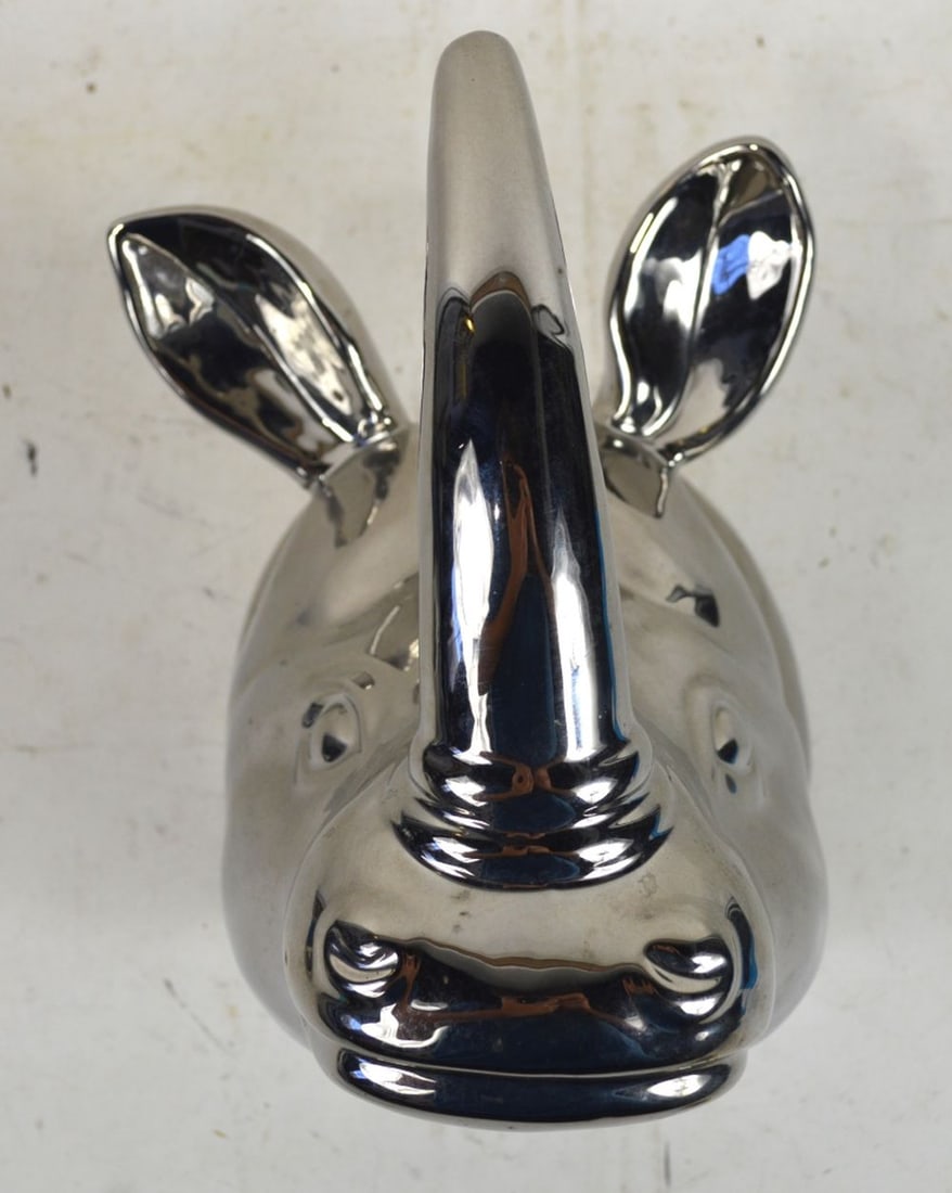 SILVERED RHINO HEAD WALL MOUNT: A decorative chromed / silvered pottery Rhino head. Far better than going after an endangered species..... Measures: 11" x 7" x 9"