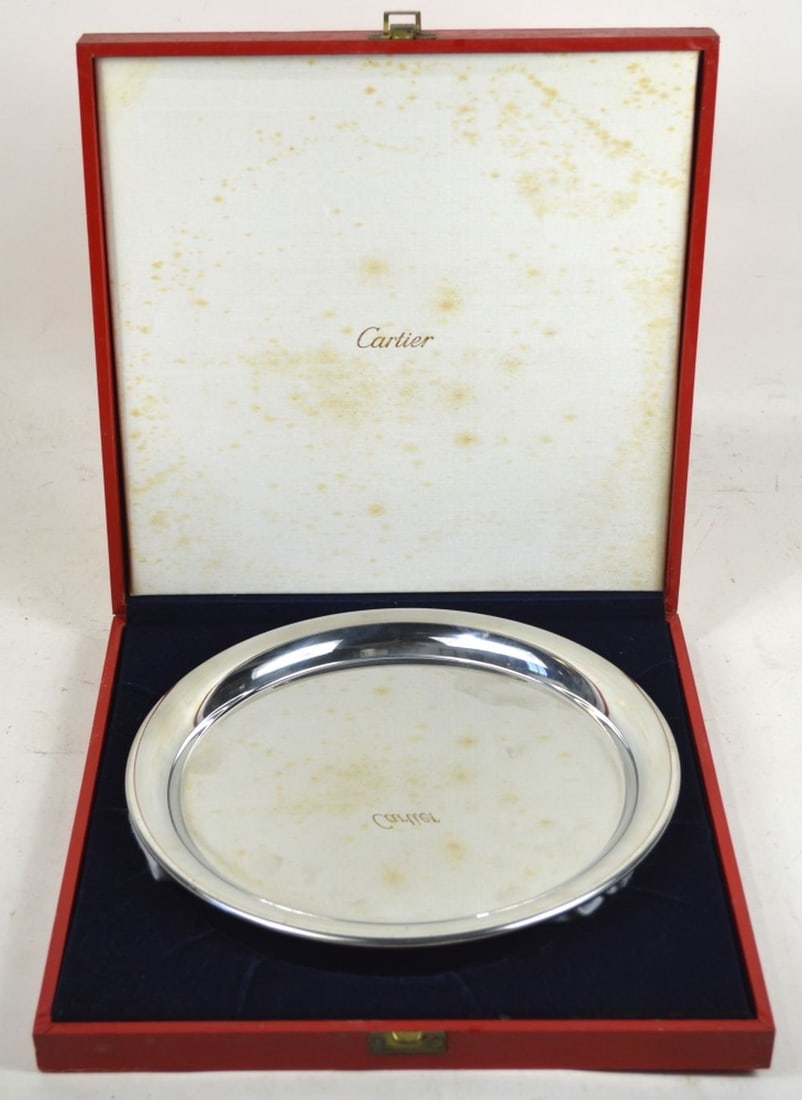 CARTIER POLISHED PEWTER PLATE ORIGINAL BOX: A Cartier polished pewter plate (signed) in it's original box. Measures: 12 3/4" x 12 3/4" x 2" Plate: D 11"
