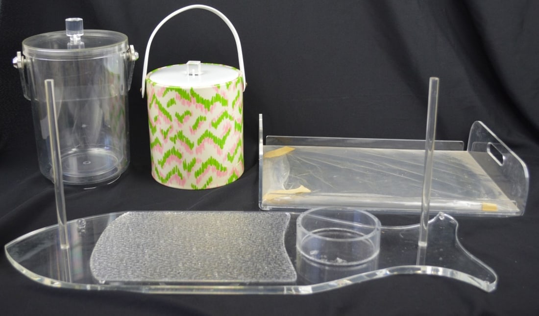MCM LUCITE GROUPING: A group of mid century lucite serving pieces. Includes 2 ice buckets, and an unusual bagel service tray. Measures: Largest 30" x 7" x 2"