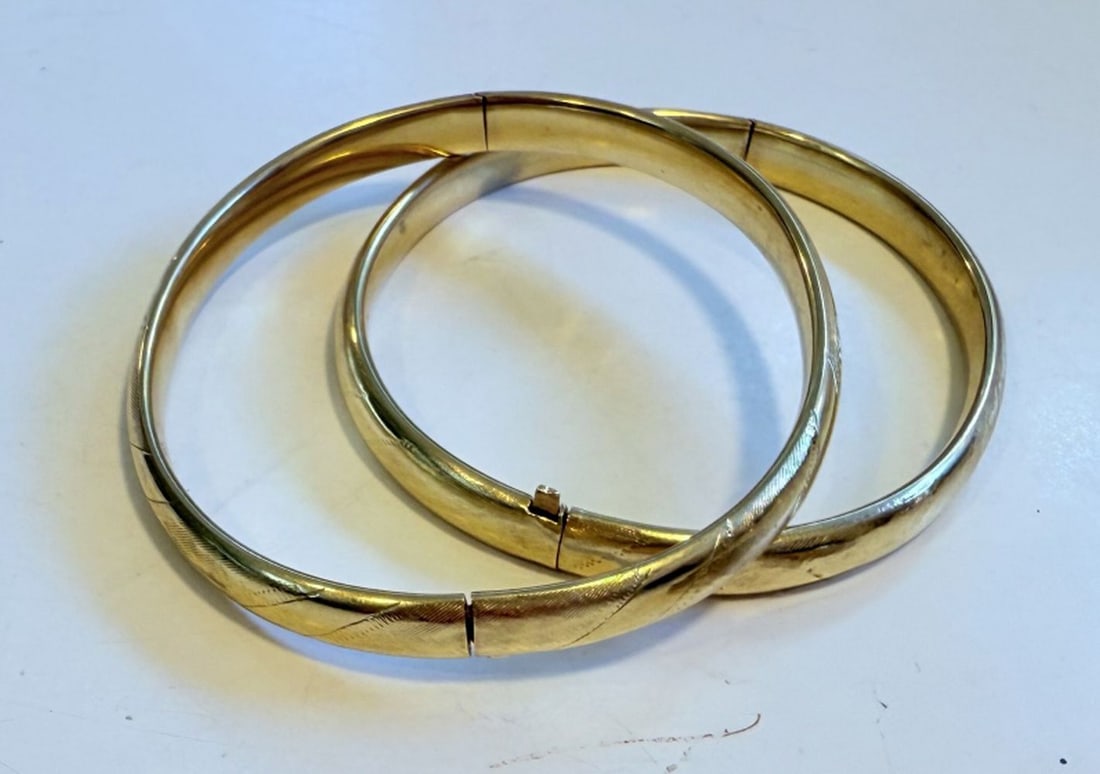 14K GOLD BRACELETS (2): Pair 14K gold (tested) latching bangle bracelets. .502 OZT / 15.63 Grams. Measures: Bracelets - L 2 1/2" x W 2 1/4"