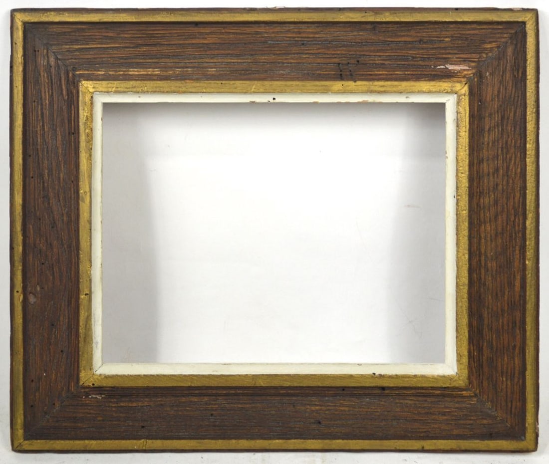 HEYDENRYK AMERICAN MODERNIST WORMY CHESTNUT FRAME: A modernist wormy chestnut frame with giltwood edging. House of Heydenryk. Measures: 15 1/2" x 18 1/4" Rabbet: 9 1/2" x 12"