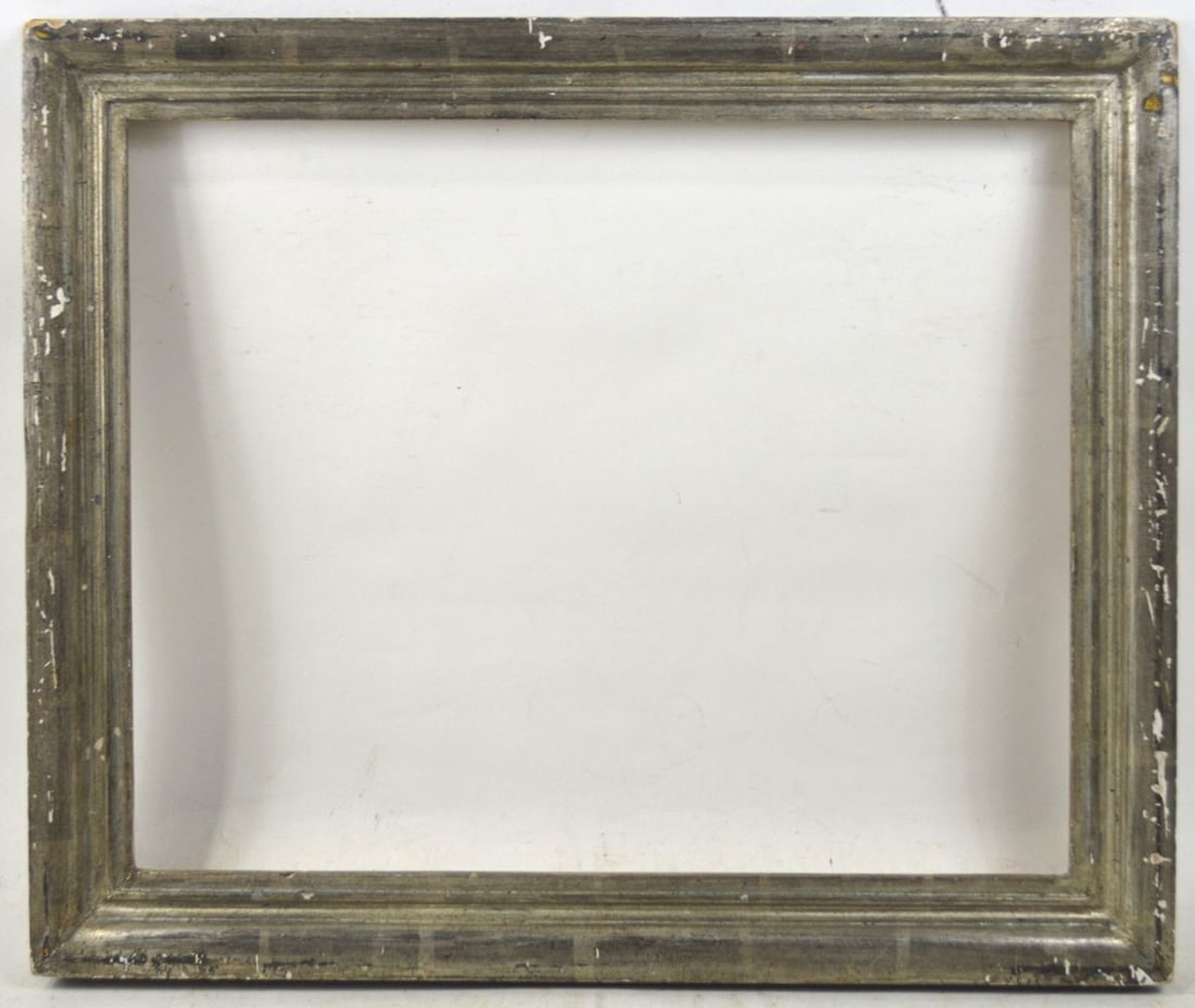 SILVER GILTWOOD FRAME: A Heydenryk modernist silver gilt frame with an ebonized outer edge. Measures: 24 3/8" x 20 3/8" Rabbet: 20 3/4" x 16 3/4"