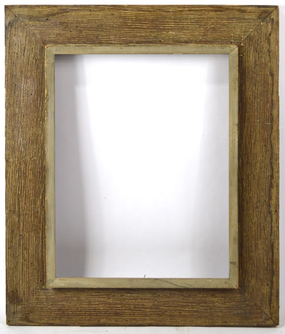 HEYDENRYK MODERNIST WIDE WORMY CHESTNUT FRAME: A House of Heydenryk (label verso) wormy chestnut American modernist frame. Wide striated frame with a raised inner border. Measures: 28" x 23 1/4" Rabbet: 20 1/4" x 15 1/4"
