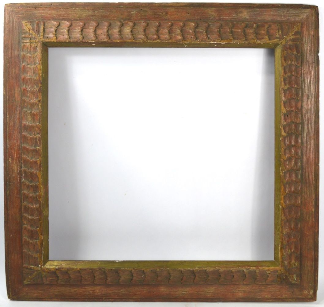 VERY FINE CARVED MODERNIST HEYDENRYK FRAME: A very fine carved and figured American modernist frame in wormy chestnut by Heydenryk. Finished in a subtle brick red monochrome which is offset by the feathered textured carving and angled