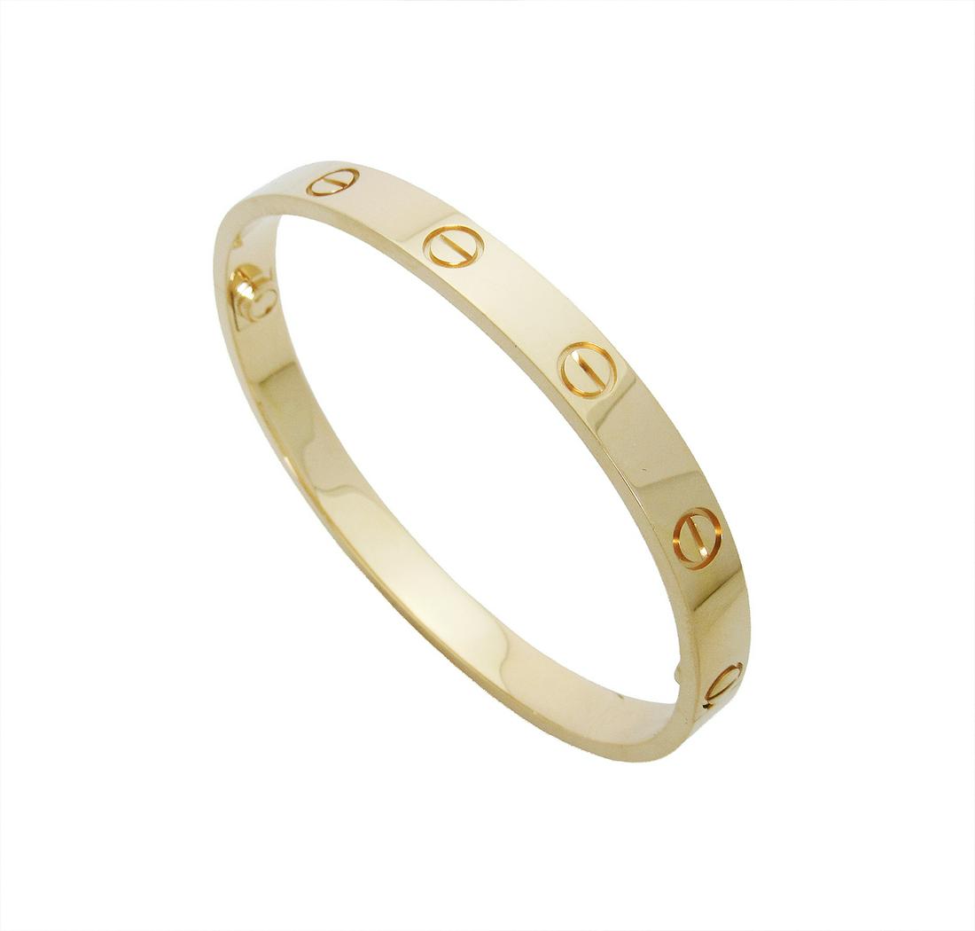 Cartier Love 18k Yellow Gold Size 17: Cartier Love 18k Yellow Gold Size 17 Metal: 18k Yellow Gold Size: 17Excellent condition. Comes with Cartier Box and Screwdriver