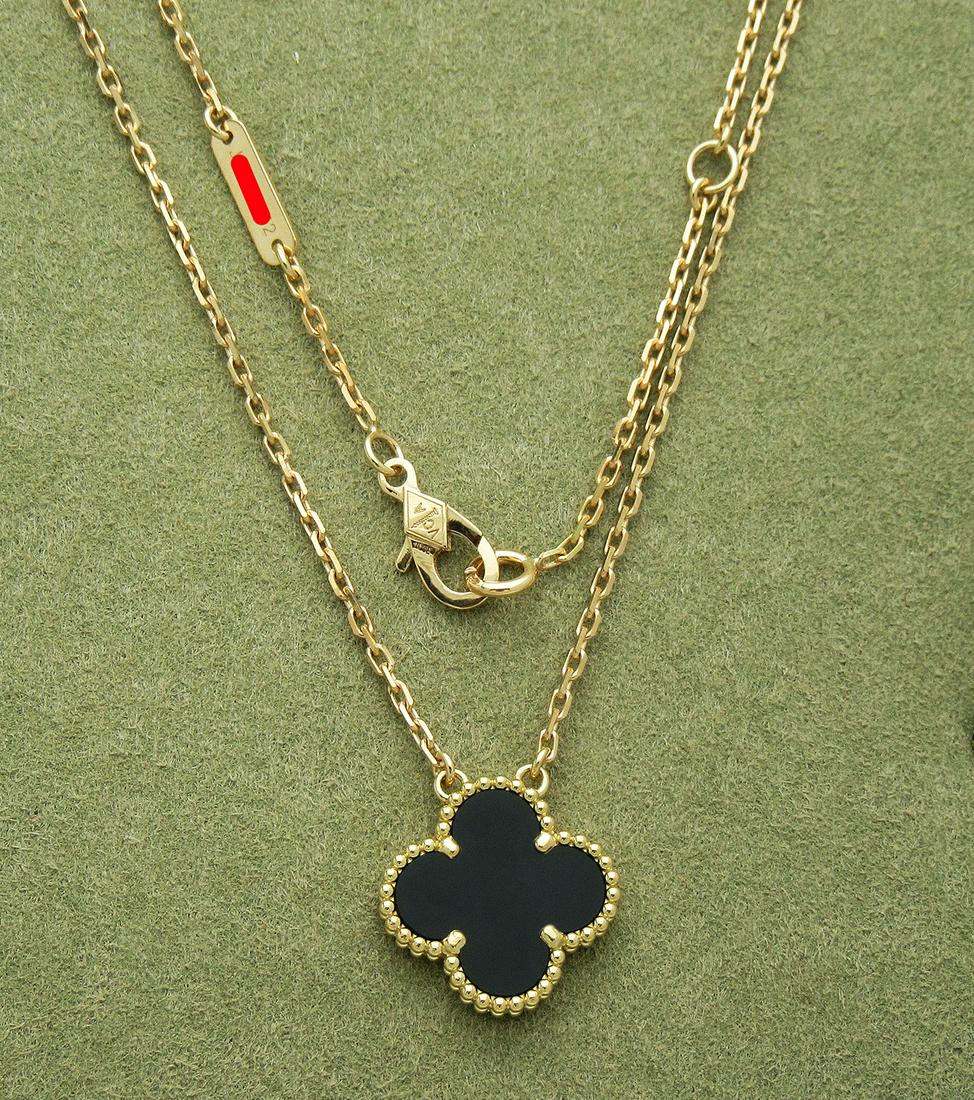 Van Cleef & Arpels 18K Magic Alhambra Black Onyx: Van Cleef & Arpels Magic Alhambra Black Onyx necklace, 1 motif Metal: 18k Yellow Gold Stone: Black Onyx Motif measurements: 15 mm. x 15mm. Chain length: 16" Weight: 13.2g. Condition: Very Good pre-own