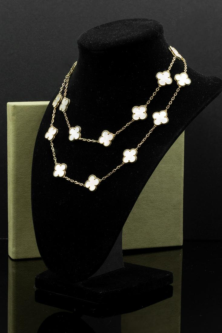 Van Cleef Alhambra necklace 18k 20 motif: Van Cleef Alhambra necklace 18k yellow gold, 20 motifs w/ mother-of-pearlWeight: 42 grams31 inch long