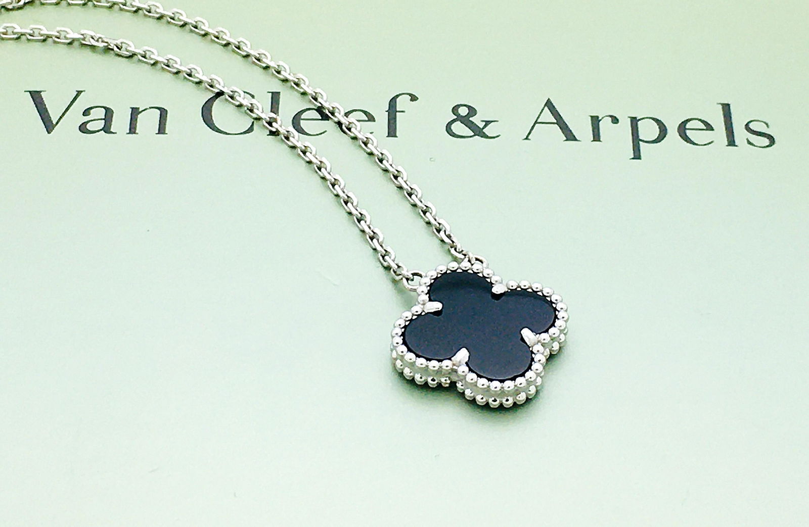 Van Cleef & Arpels 18k Vintage Alhambra Pendant: Van Cleef & Arpels 18k White Gold Vintage Alhambra Pendant NecklaceOnyxBRAND : Van Cleef & Arpels COLLECTION: Vintage AlhambraSTONES: 1 OnyxSIZE: 16.8"CONDITION: Excellent Like New!!