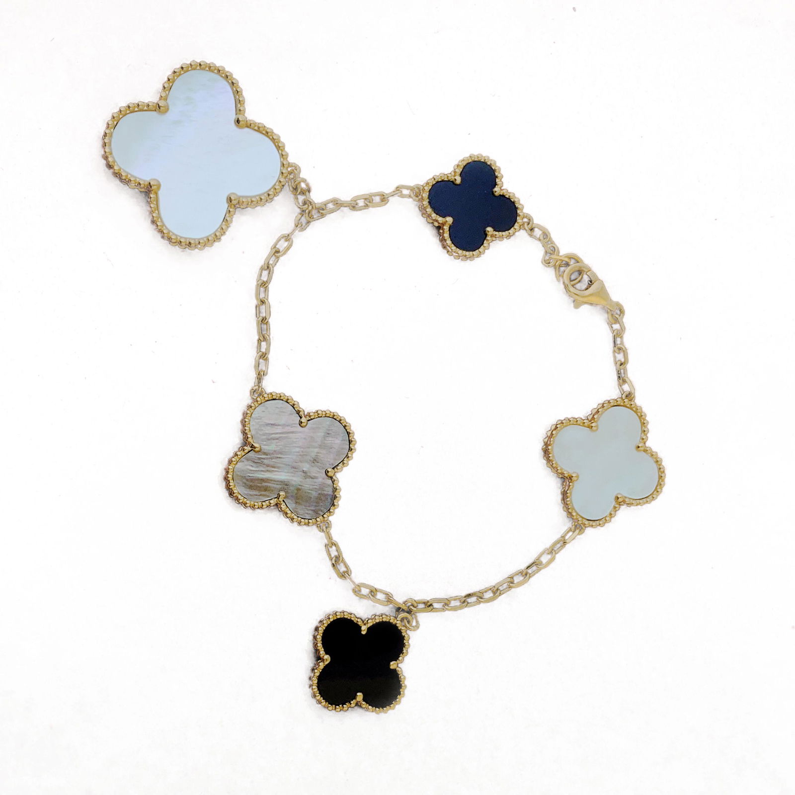 Van Cleef & Arpels Magic Alhambra bracelet, 5 motifs: Van Cleef & Arpels Magic Alhambra bracelet, 5 motifsBrand: Van Cleef & ArpelsCollection: Magic AlhambraCondition: ExcellentMetal: 18K Yellow gold bracelet with 5 motifs of Mother-of-pearl and Onyx STO