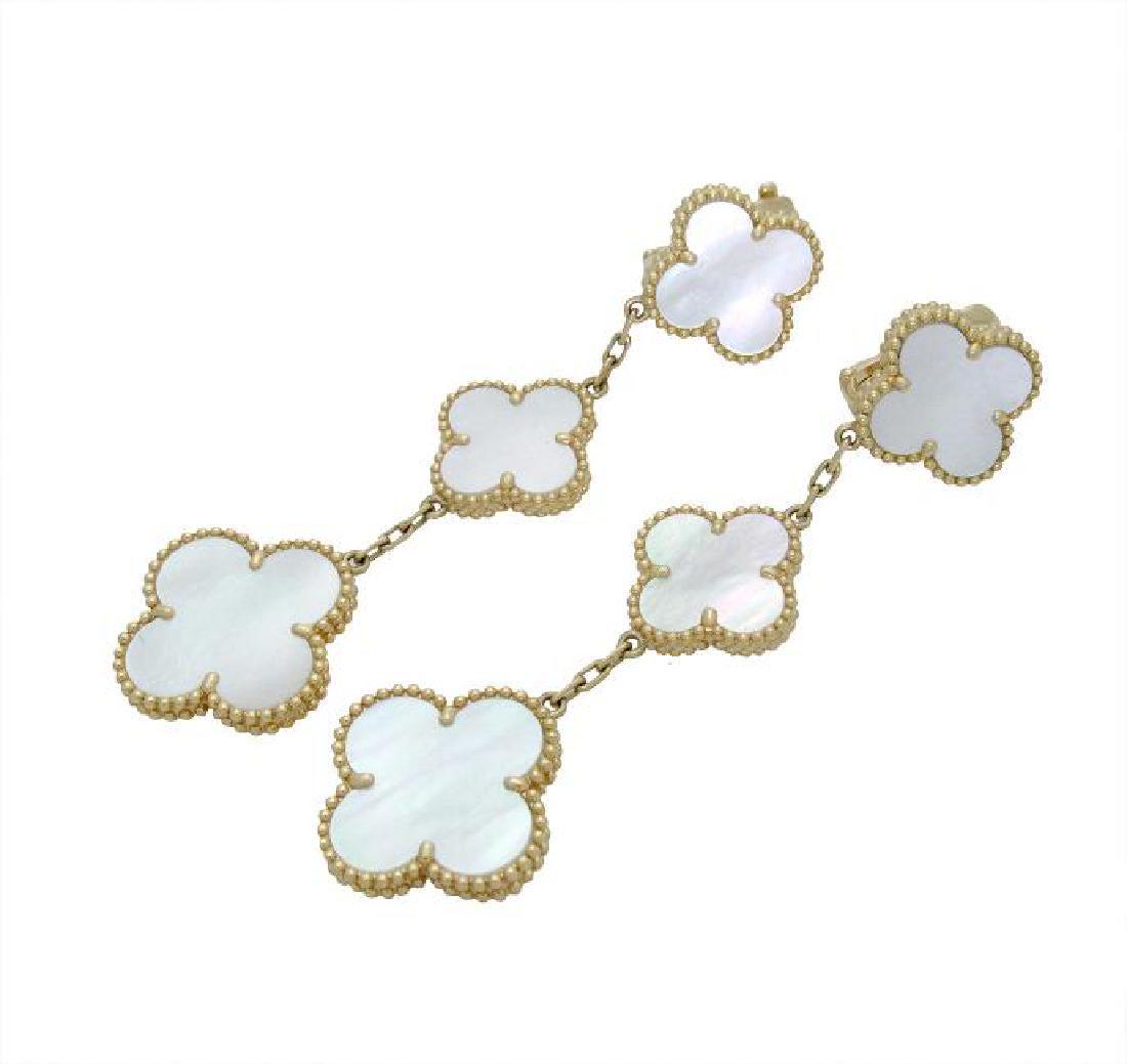 Van Cleef & Arpels Magic Alhambra 3 Motif Earrings: Van Cleef & Arpels Magic Alhambra earrings, 3 motifs Yellow gold, Mother-of-pearl Metal: 18k Yellow Gold Gemstone: Mother of Pearl Motif measurements: 15mm . and 20mm. Earrings measurements: 68mm. Len