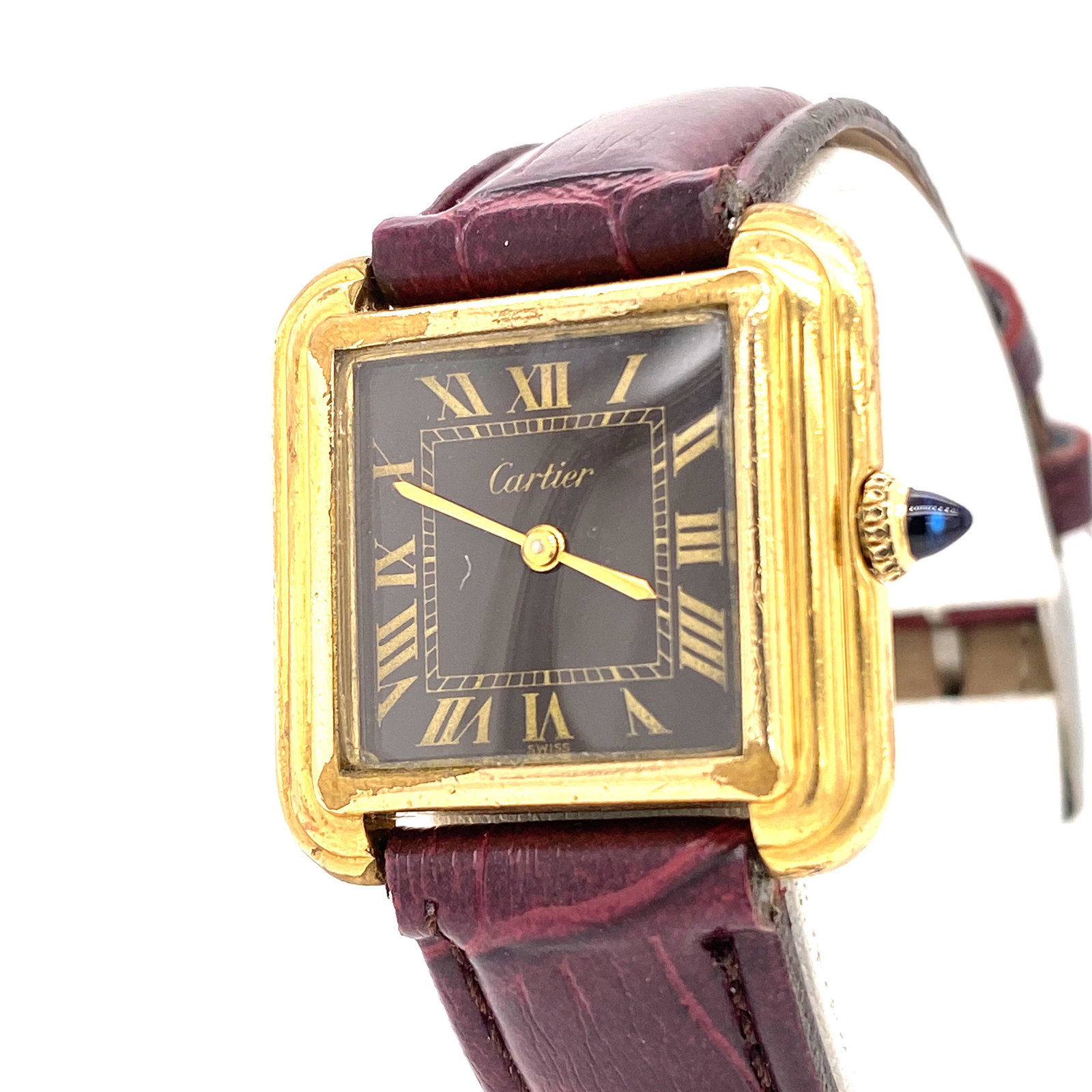 CARTIER plaque d'or Cartier wristwatch: Dark brown dial with Golden hands and Roman numeral. Sapphire cristal. Case size: 1.10x1.25''. Back engraved "CARTIER plaque d'or Cartier".