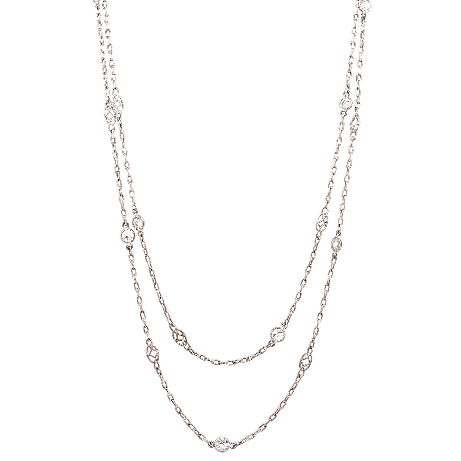 Diamond by the Yard Necklace: Diamond by the Yard Necklace with 20 Full Cut diamonds Approx 1.45 CT. Color: H. Clarity VS1-SI1. Chain Length: 43". Weight: 7.7g.