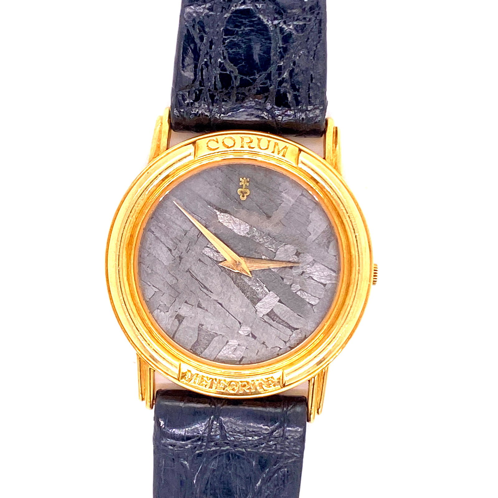 Corum Meteorite 18K Gold Limited Edition: CORUM METEORITEMETEORITE DIAL OF COSMIC ORIGIN IMPACT POINT 19’ 27’;99’ 35’ W MEXICO Measurements 32mmx36mm//