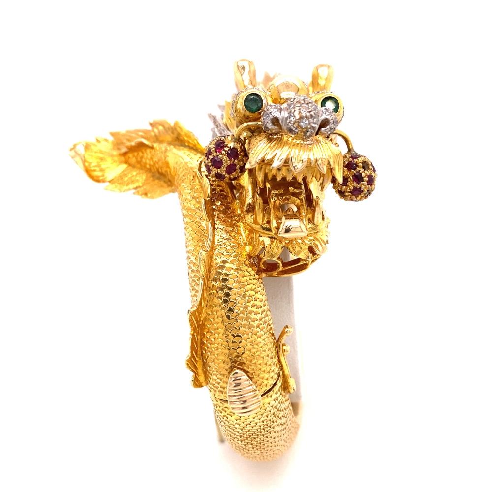 14k Diamond Emerald Rubi Chinese Dragon Bracelet: 14k Yellow Gold Weight 92.7 gr. Diamond Approx. 1ct. Emerald Rubi Measurement 1.9” x 7” Chinese Dragon Bracelet