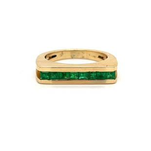 18k Emerald Ring: 18k Yellow Gold Weight 6.5g Emerald Approx. 0.70ct Ring Size 6.5 Measurement 0.18”x0.85”