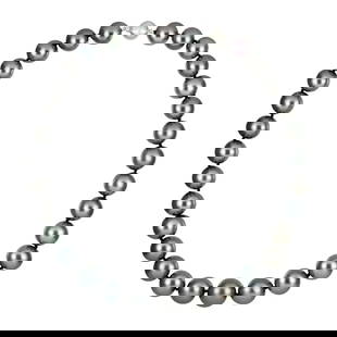 Tahitian Pearl Necklace: Graduated Necklace with 33 Gray Tahitian pearls graduating from 11.5mm to 14.5mm with 18k white gold with approximately 0.15 carats of round diamonds. 92.7 grams