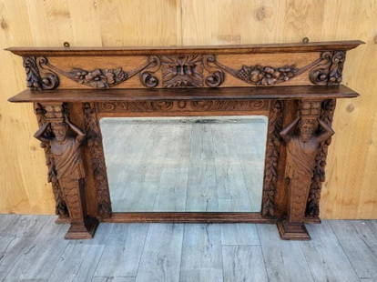 ANTIQUE NEOCLASSICAL FIREPLACE: ANTIQUE NEOCLASSICAL HAND CARVED FIGURAL AND FOLIATE QUARTER-SAWN FIREPLACE MANTEL BEVELED MIRROR TOPPER D 7.5” W 61.5” H 37.5” Location for this lot: Chicago Shipping for this lot: