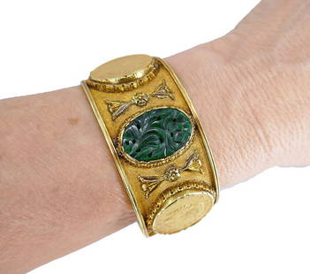 Mario BUCCELLATI Gold Coin BRACELET Carved Jade Vintage Bangle Estate Jewelry: A rare Mario Buccellati 18k gold coin bracelet, featuring carved jade. This sculptured bangle bracelet carries four collectable coins. All the coins are bezel set and mounted into beautiful, pierced f