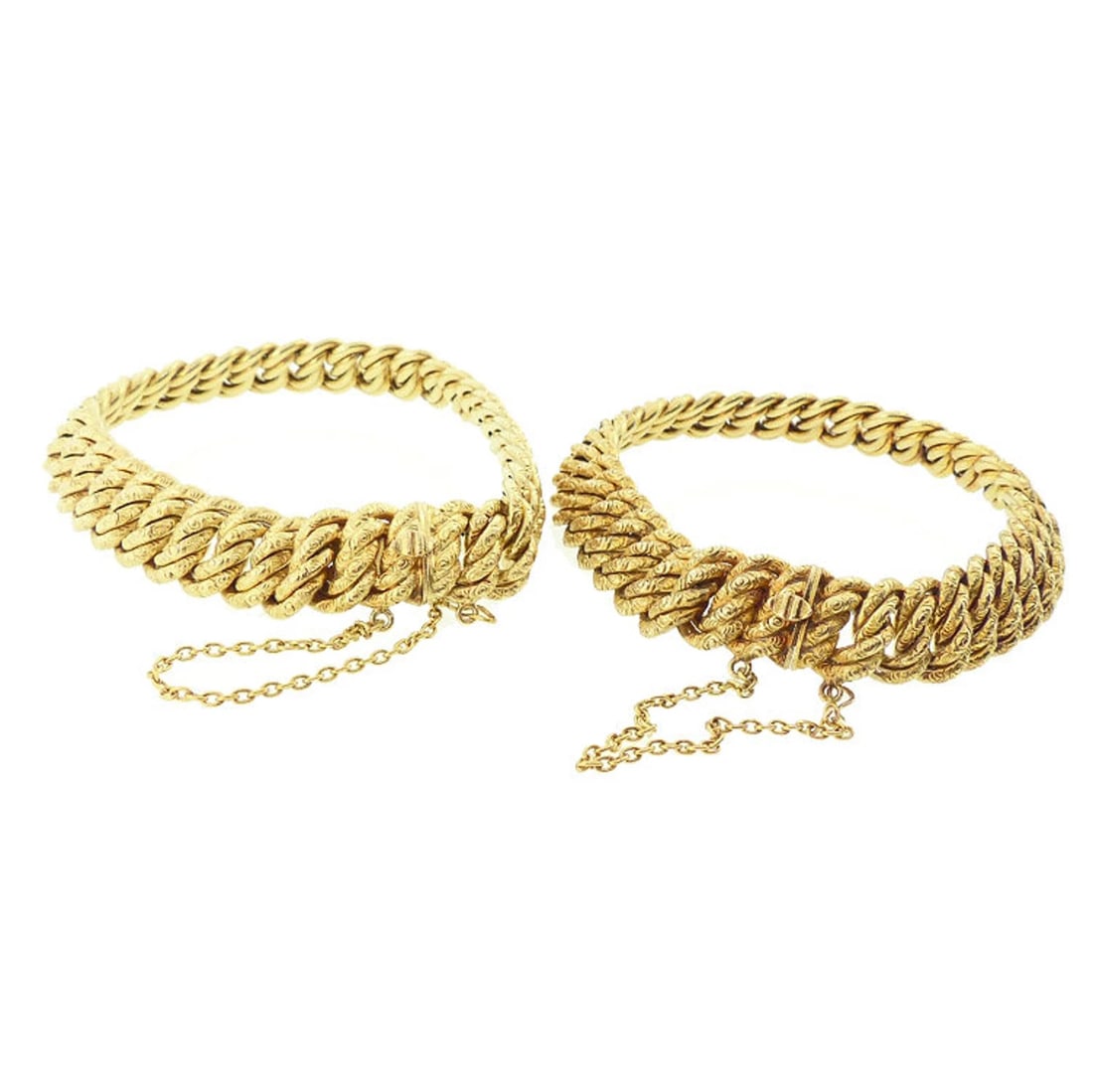 Pair Imperial Austrian 14K Gold Repousse Double Curb Link Bracelets: The clasp of each bracelet is stamped with Viennese 14K gold marks used 1872-1902. The bracelets are priced as a pair, but are available separately. Origin: Austro-Hungarian Empire, 1872-1902 Conditio