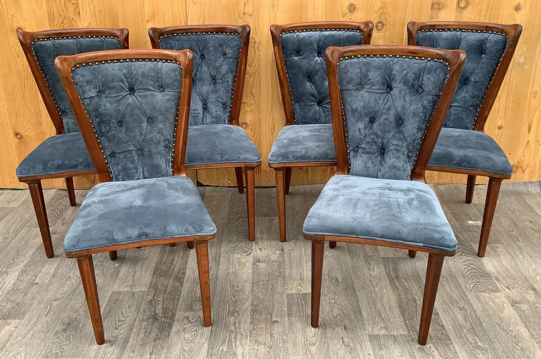 Vintage Italian Art Deco Sculptural Curved Back Dining Chairs Newly Upholstered in a Holly Hunt Blue: The Vintage Italian Art Deco Sculptural Curved Back Dining Chairs, newly upholstered in Holly Hunt Blue Suede, form a stunning and unique set of six. These chairs, originating from the 1950s, represen