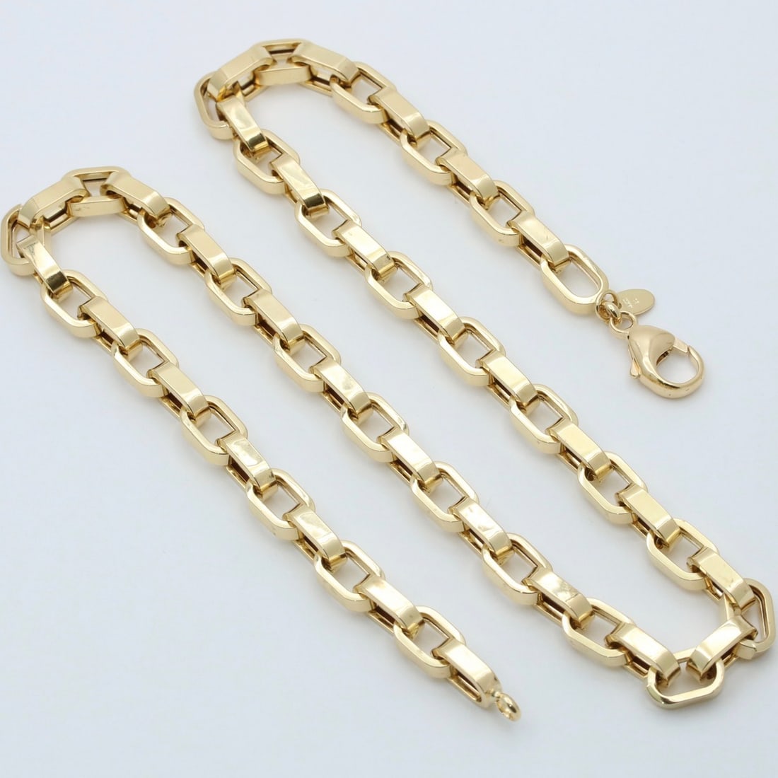 18K Gold Biker Link Chain, 18â€ Long: 18K Gold Biker Link Chain, 18â€ Long. Metal: 18K Yellow Gold Weight: 31.3 grams Measurements: 18â€ long by 6.6 mm wide (fits slightly shorter due to design) Markings: