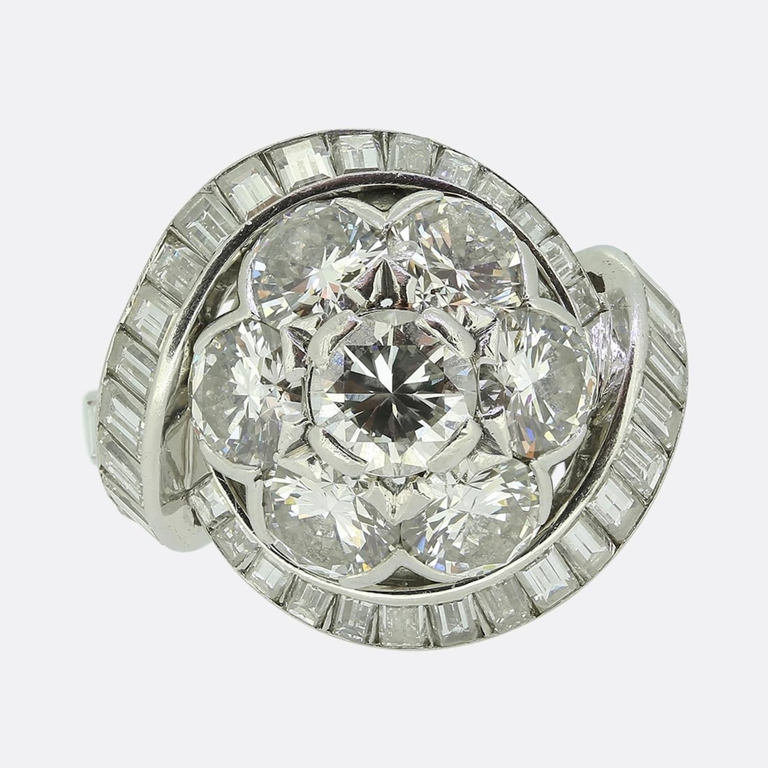 Van Cleef & Arples Diamond Cluster Ring: Van Cleef & Arples Diamond Cluster Ring. Weight:Â 9.3Â grams Ring Size:Â M (53) Band Width:Â 4mm - 2mm Centre Diamond Weight:Â Approx. 0.64ct Total Re