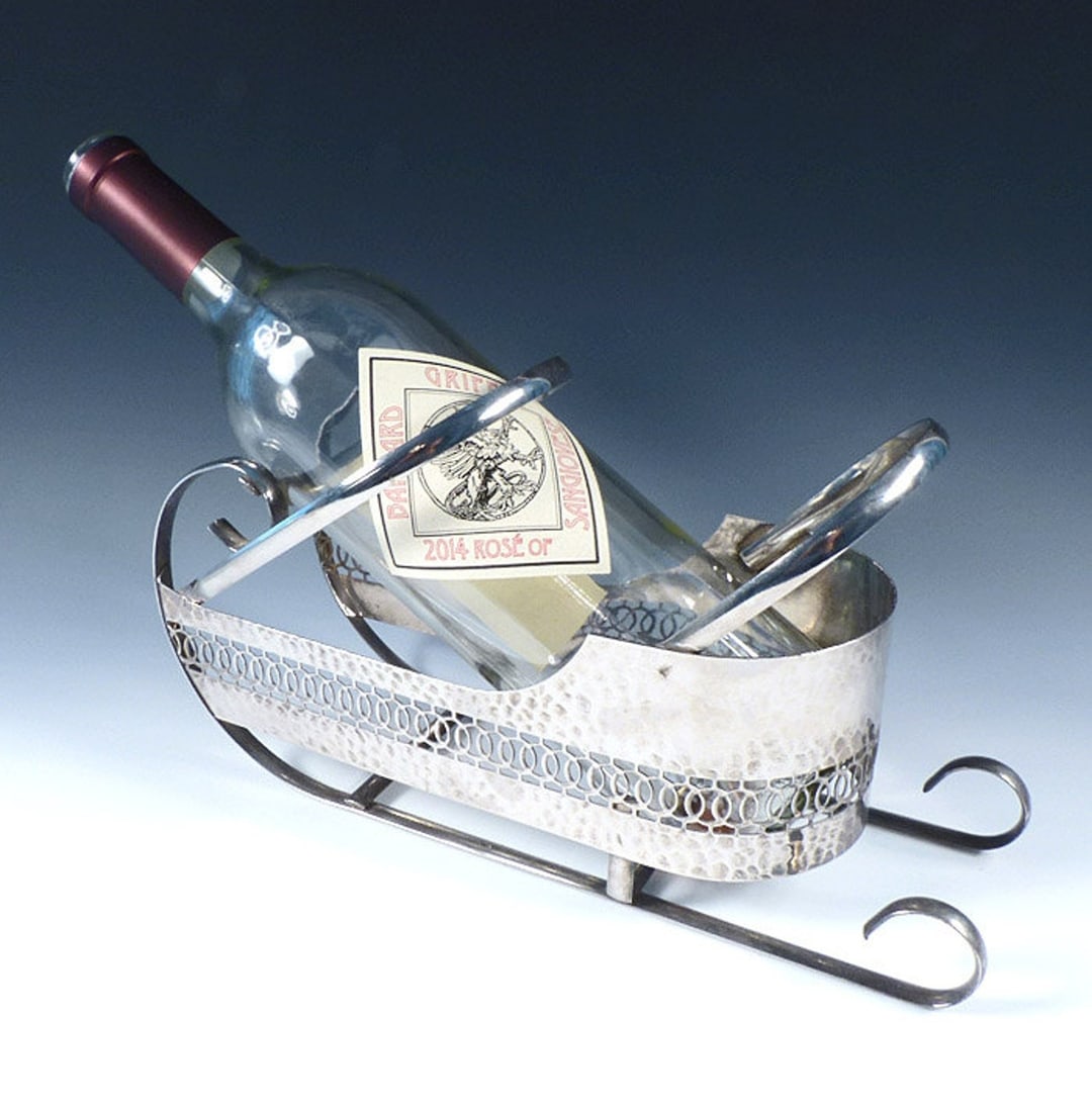 Art Deco Chrome Wine Bottle Sled: Art Deco Chrome Wine Bottle Sled. â€¢ Origin: America, ca. 1945. â€¢ Condition: excellent. â€¢ Dimensions: 10" long, 3-5/8" wide, 5-5/8" tall.