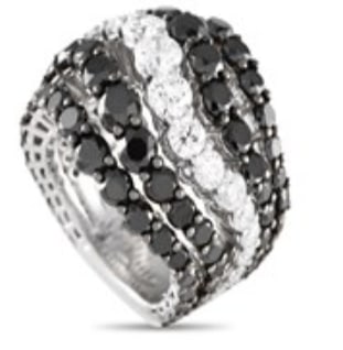 A stunning array of diamonds makes this Bucherer ring simply unforgettable. Alternating bands of: Bucherer 18K White Gold 10.86ct Black and White Diamond Ring BU13-071224