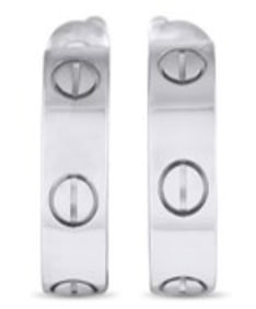 A lovely pair of Cartier Love huggie hoops forged in precious white gold. They sit close to the