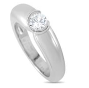 A round-cut 0.55 carat Diamond makes a statement at the center of this stylish Cartier Eclipse ring.