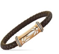 This Charriol bracelet is made out of rose PVD-plated stainless steel and brown rubber. The bracelet