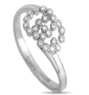On this Gucci Double G ring, the luxury brands iconic logo comes to life thanks to sparkling