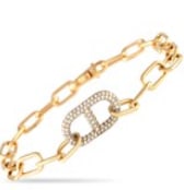A series of delicate 18K white gold links covered in diamonds totaling 4.35 carats come together to