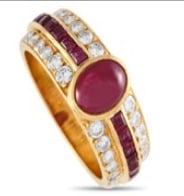 Diamonds and rubies go together so beautifully, as revealed by this stunning ring. The 18K yellow