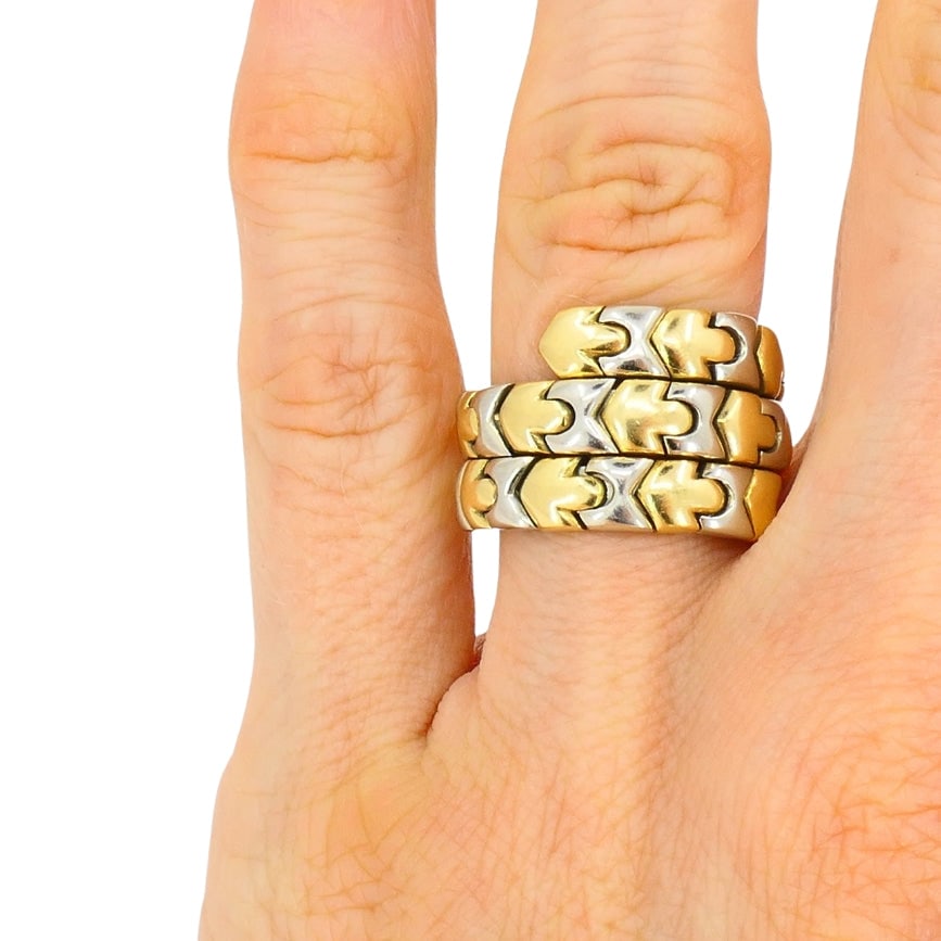 Bvlgari Bulgari Two-Tone Gold Ring Wrap Around 18k: Designer: BulgariCirca: 1980sMaterials: 18k Yellow and White GoldWeight: 16.4 gramsRing Size: 6.5Hallmarks: Maker's mark, a serial number, a hallmark for 18k goldThis vintage Bulgari ring is made of 1