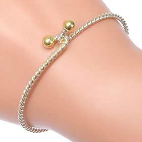 Like new Tiffany & Co. 6.0g Hook Eye Twist Bangle in 925 Sterling Silver and 18K Yellow Gold