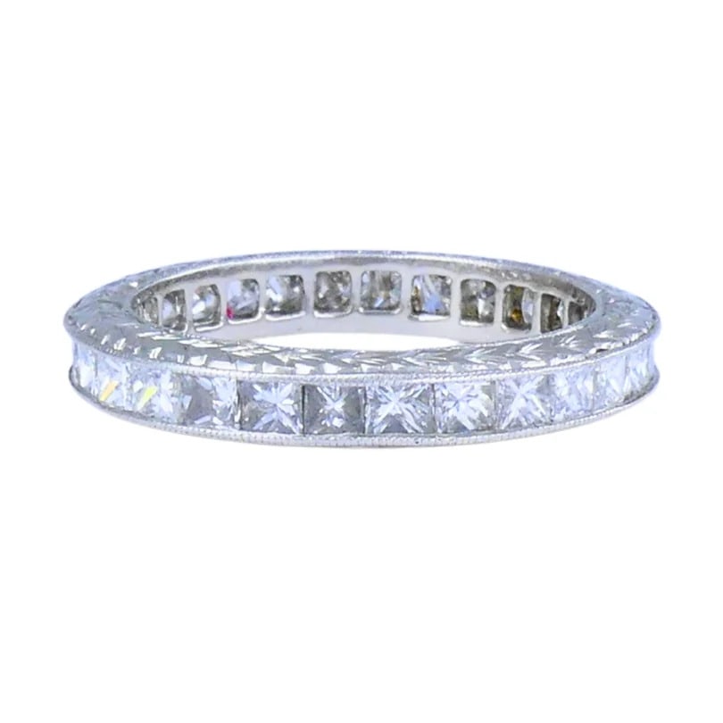 Michael Beaudry Princess Cut Diamond Eternity Band Platinum Size 6.5 Wedding Ring: Designer: Michael BeaudryCirca: 2000sMaterials: PlatinumGemstone: Diamond Princess Cut, 28, F-G/VS, 1.74 Carats TotalWeight: 4.3 GramsMeasurements: Width 3.3 mmRing Size: 6.5-6.75, non-sizableHallmark