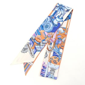 Salvatore Ferragamo scarf/muffler in orange, ivory, and blue. 100% silk ribbon scarf/bag charm for