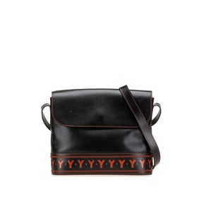 Vintage Yves Saint Laurent YSL Cutout Crossbody Shoulder Bag in Black and Orange Leather for Women.