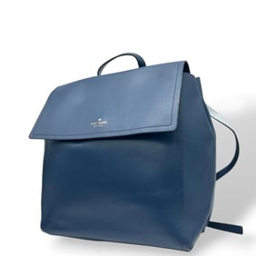 Kate Spade navy blue backpack with A4 storage, flap, leather, logo plate, and silver hardware.