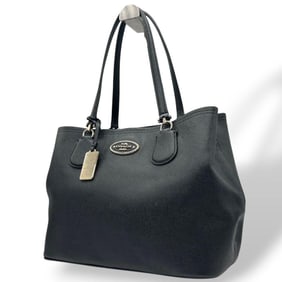 Coach black tote bag with logo plaque, one-shoulder design, A4 storage capacity, leather handbag,