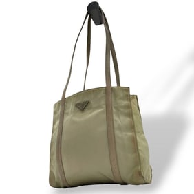 Prada Tessuto tote bag in beige with a triangular logo plate and silver hardware. Can be worn over