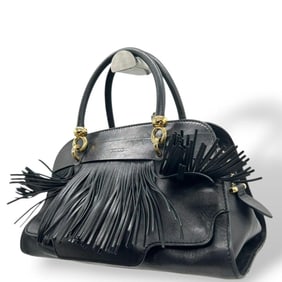 Tod's fringed leather handbag in black with gold hardware and a brand logo.