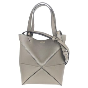 LOEWE Puzzle Fold Tote Mini in soft grained calfskin and taupe. This foldable bag is perfect for