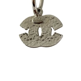 CHANEL Coco Mark motif plated rhinestone earrings in silver, 28194
