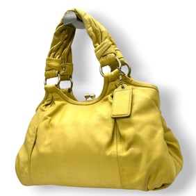 Coach Brooke handbag (13437) in yellow leather with a kiss-lock clasp closure. This one-shoulder bag